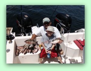 5 year old anglers catch fish and learn boating safety on fat cat charter fishing Tampa bay Florida.
